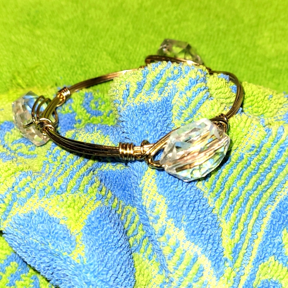 Gold wire bracelet with 3 large transparent stones